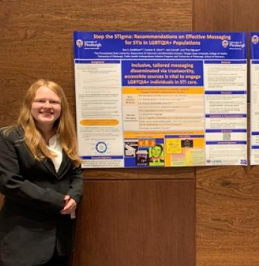 students standing with poster